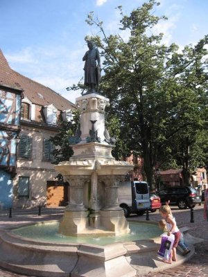 Roesselmann Fountain sculpture by Frédéric Auguste Bartholdi in a public square