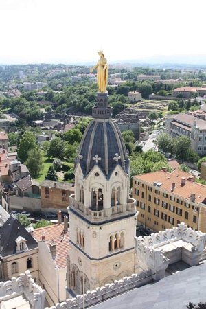 Statue of the Virgin Mary atop the belfry of Chapel Saint-Thomas in Fourvière