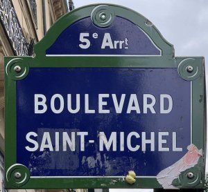 Stone plaque showing boulevard Saint-Michel street name in Paris