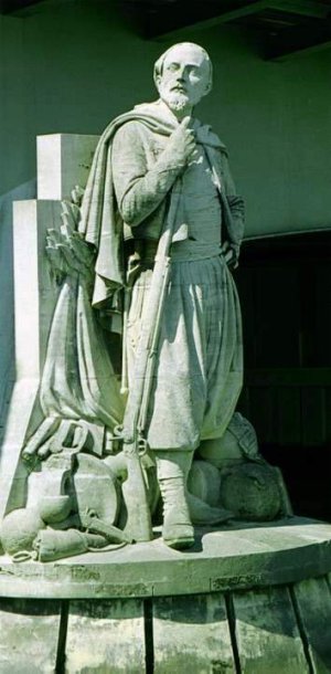 Stone statue of the Zouave soldier on the Pont de l'Alma in Paris