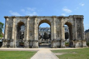 ancient Roman triumphal arch known as Porte de Mars in Reims, wide stone arch with detailed carvings