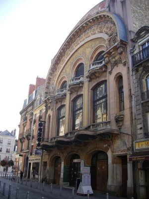 Exterior view of Cinema Opéra building in Reims with ornate marquetry and classical architecture