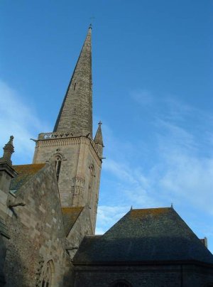 Upward view of the tower of Saint-Malo Cathedral in France against a clear sky