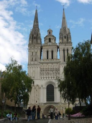 Gothic style Angers Cathedral exterior with spires and stone facade