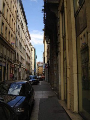 Narrow street lined with historic buildings near Place des Capucins in Lyon