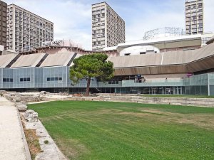 Antique port corner ruins surrounded by archaeological garden in front of Marseille History Museum