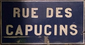 Rue des Capucins street sign with an honorary plaque dedicated to Eduarda Brasil, a transgender assassin victim, in Lyon, France
