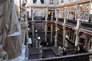 Interior view of Passage Pommeraye with ornate arches and multiple levels of shops in Nantes