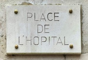 Plaque showing Place de l'Hôpital sign in Lyon near Hôtel-Dieu