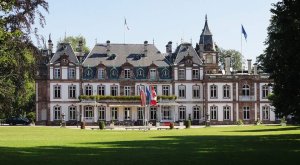 Facade of Château de Pourtalès surrounded by trees in Strasbourg